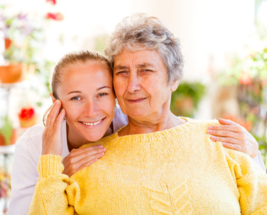 senior woman and a nurse