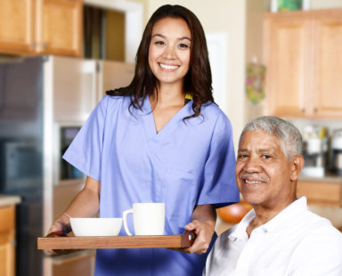 senior man with a caregiver carrying food