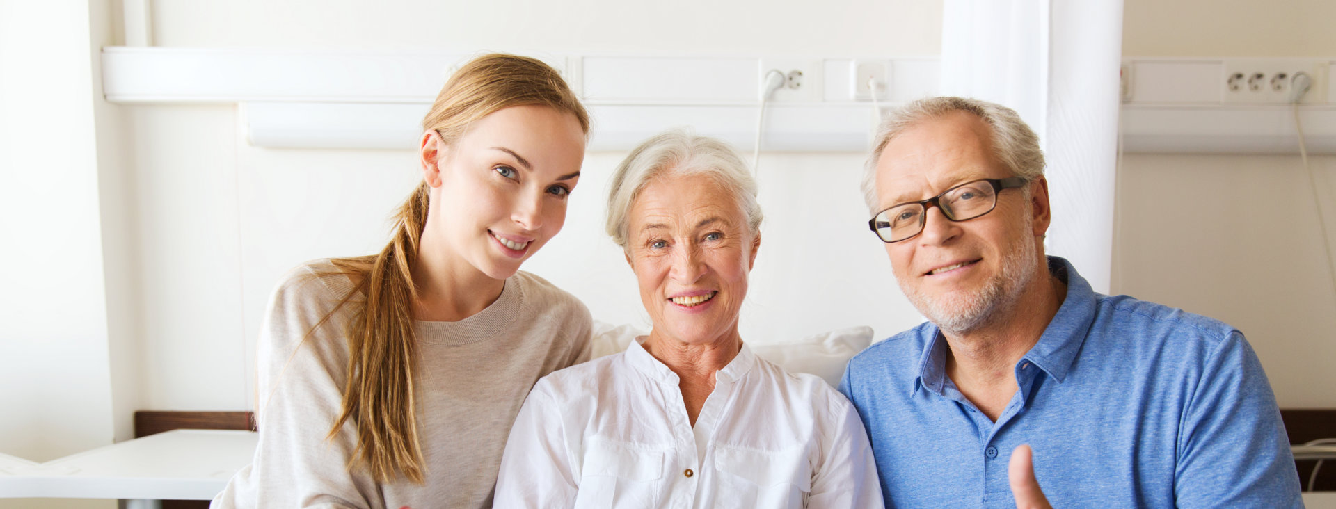 A senior couple with their daughter