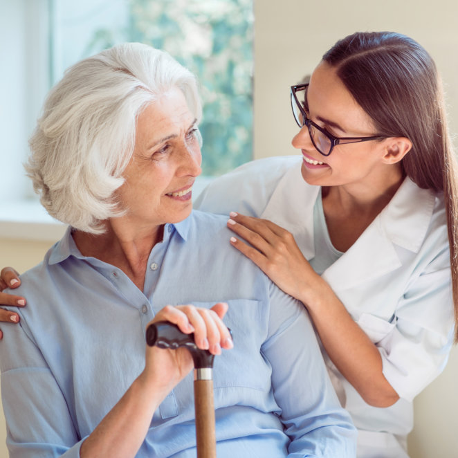 A senior woman and a female looking at each other