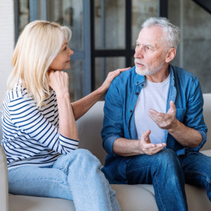 elderly couple talking to each other