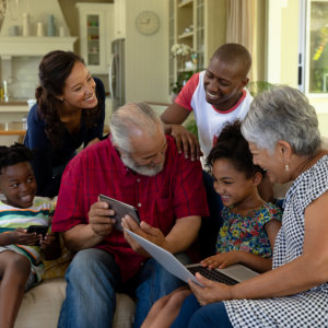 a family watching something at the tablet