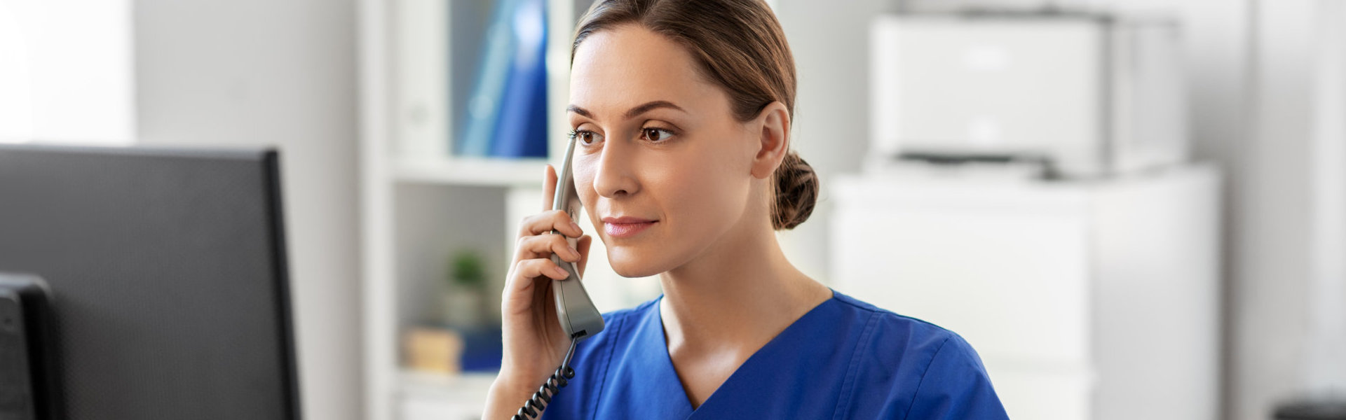 caregiver using a telephone